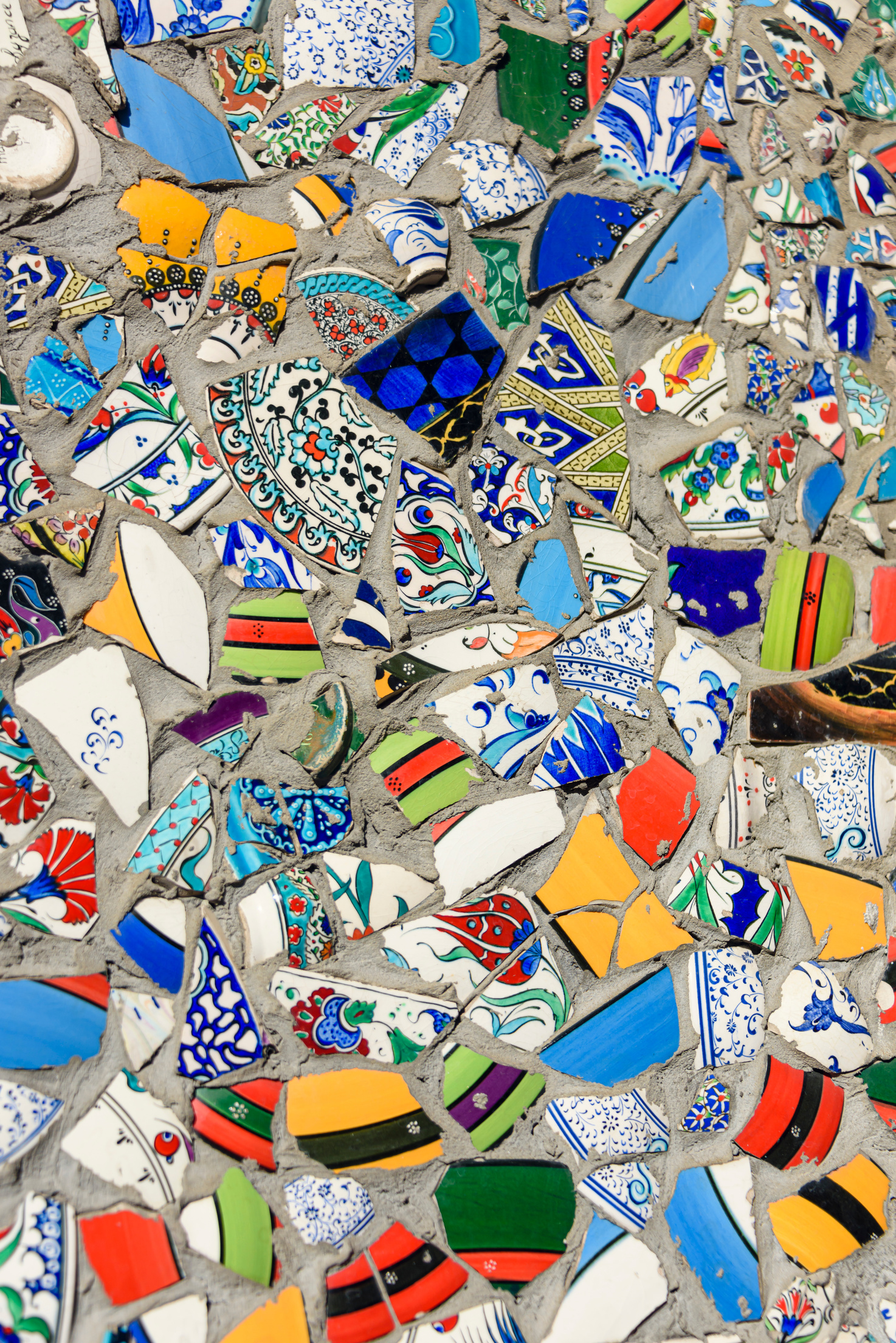 Mosiac of multi-coloured broken wall tiles on a public street, Istanbul, Turkey.